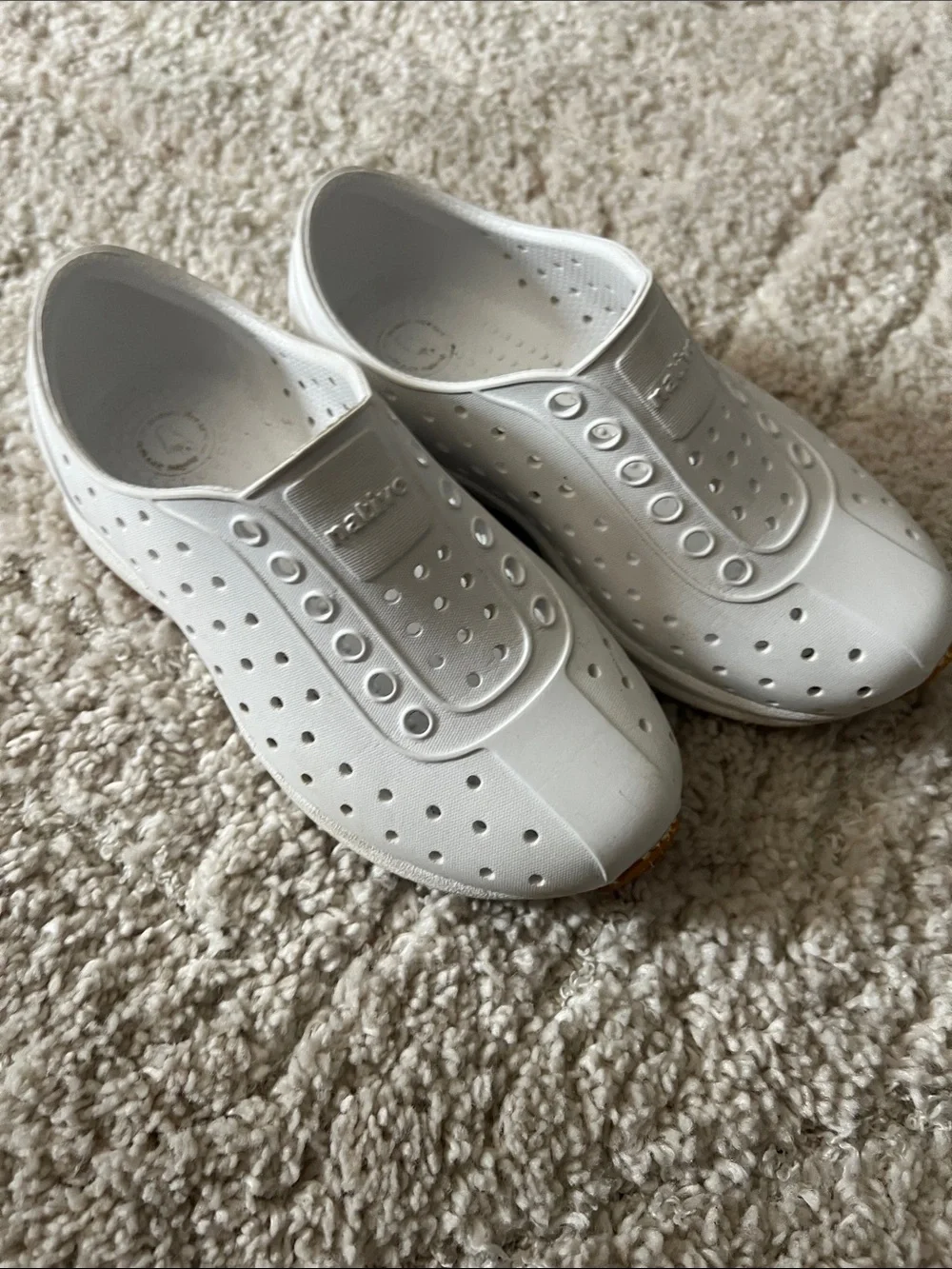 Native White Slip-On Perforated Shoes by Native